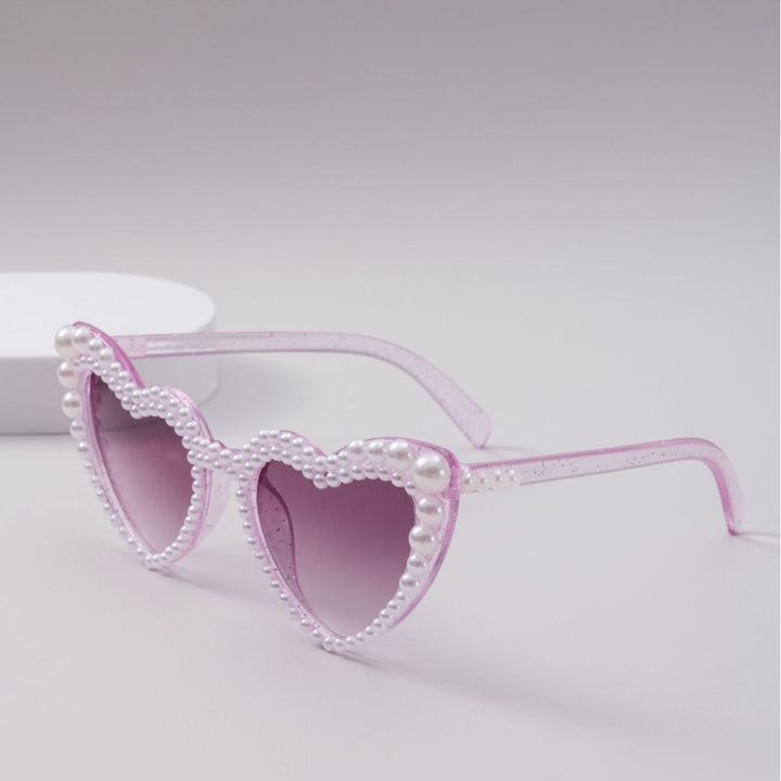 Dame designer solbrille med perleinnramming fra Luvikno