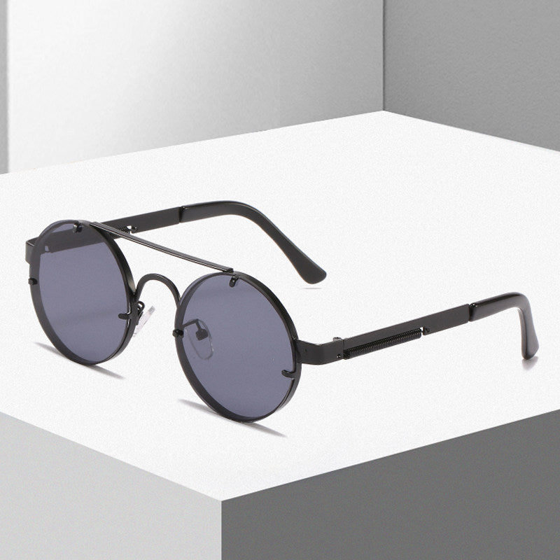 Dame rund designer solbrille med innovativ metallramme og beskyttende linser Luvikno
