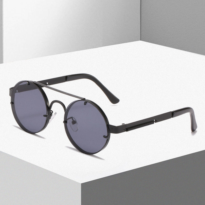 Dame rund designer solbrille med innovativ metallramme og beskyttende linser Luvikno