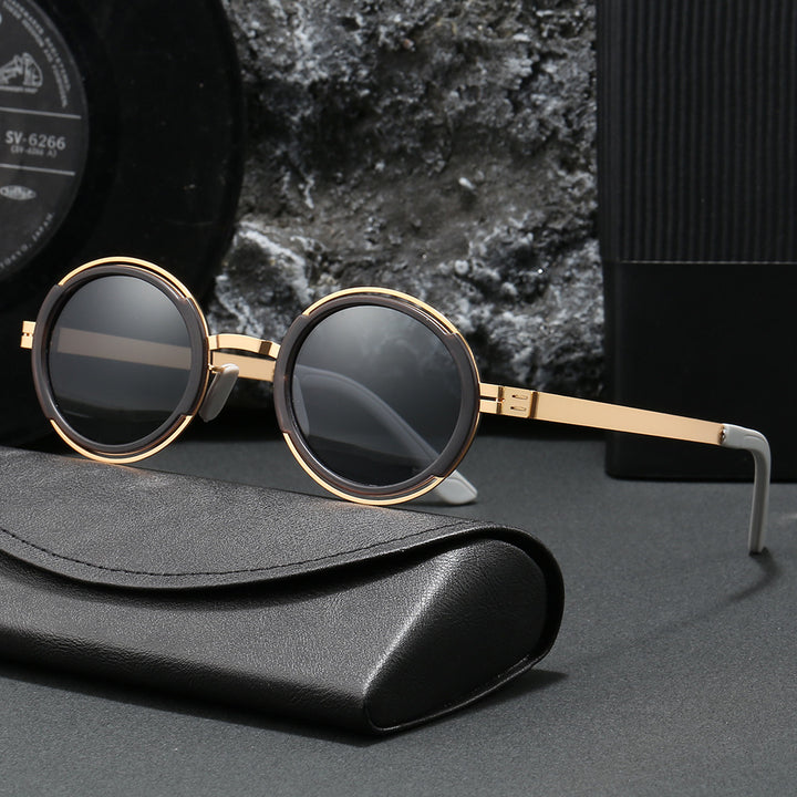 Damer moteriktig rund solbrille med elegant metallramme Luvikno