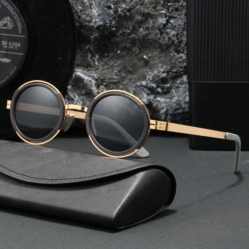 Damer moteriktig rund solbrille med elegant metallramme Luvikno