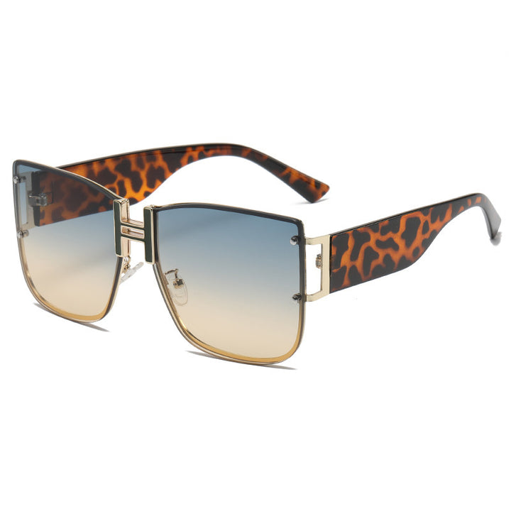 Dame solbrille i elegant design med høymoderne, organiske glass Luvikno