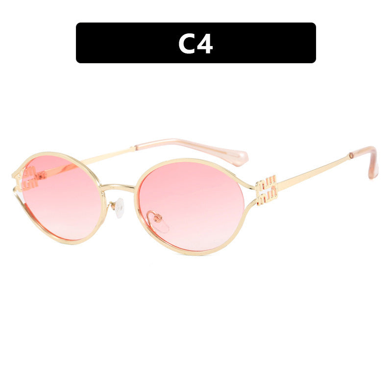 Dame ovalformet solbrille med elegant metallramme og moderne design Luvikno