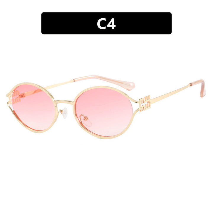 Dame ovalformet solbrille med elegant metallramme og moderne design Luvikno