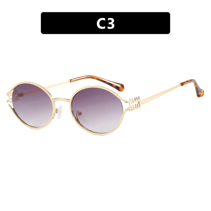 Dame ovalformet solbrille med elegant metallramme og moderne design Luvikno
