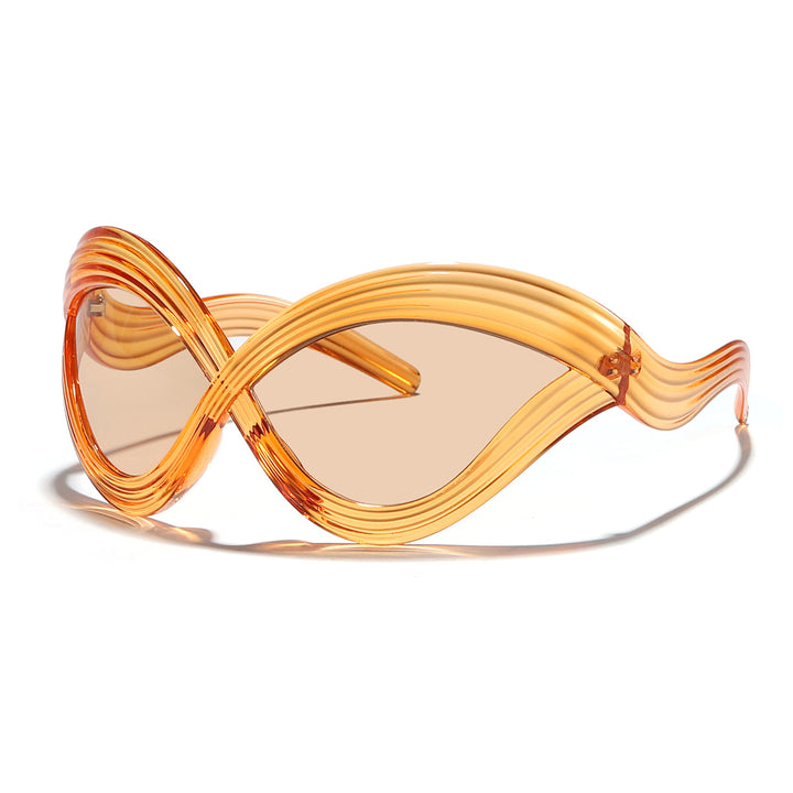 Dame moteriktig solbrille med innovativ bølkeramme Luvikno
