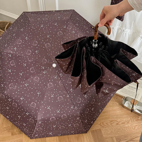 Dame sammenleggbart regnparaply med elegant anhengdesign Luvikno