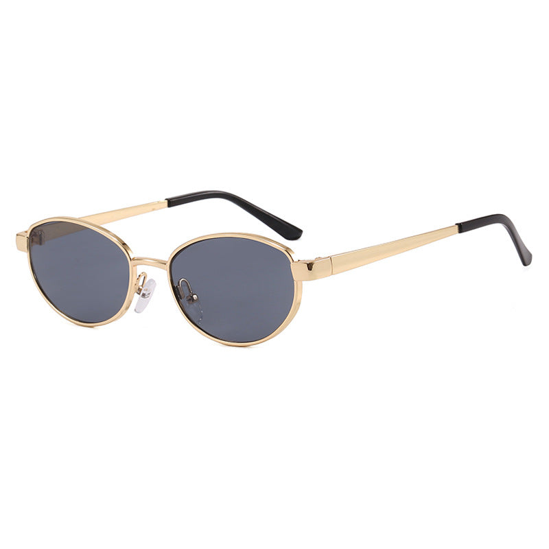 Dame moteriktig solbrille i elegant oval design med ramme i høykvalitets metall Luvikno