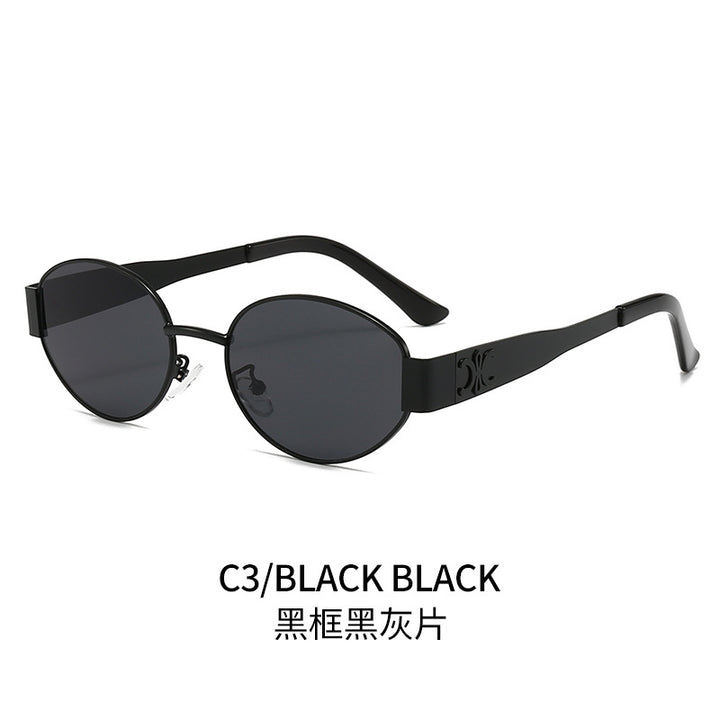 Dame Designer-solbrille med elegant oval ramme og unike aksenter Luvikno