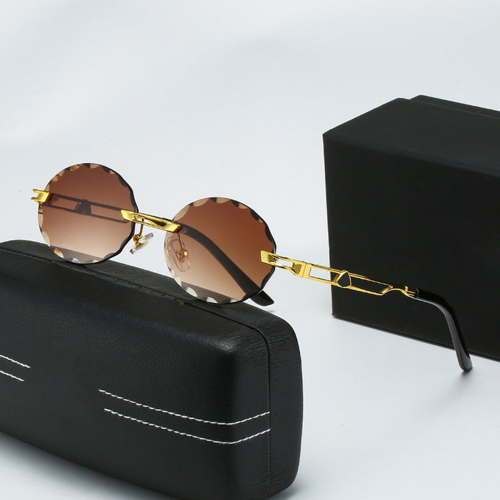 Dame rund solbrille med unikt bølgedesign og høykvalitets metallramme Luvikno