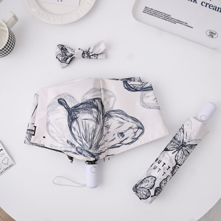 Dame fashionable foldeparaply med leken design Luvikno
