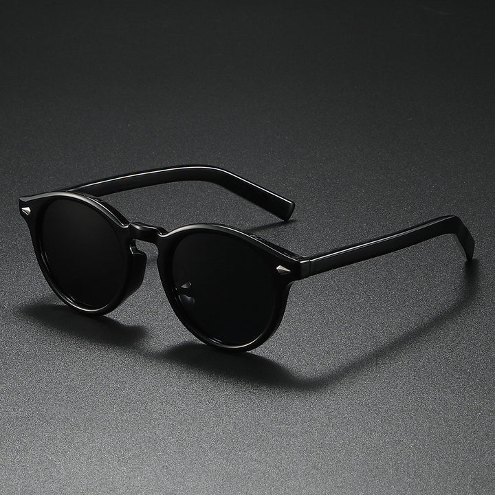 Dame Rund-solbrille med transparent ramme og reflekterende glass Luvikno