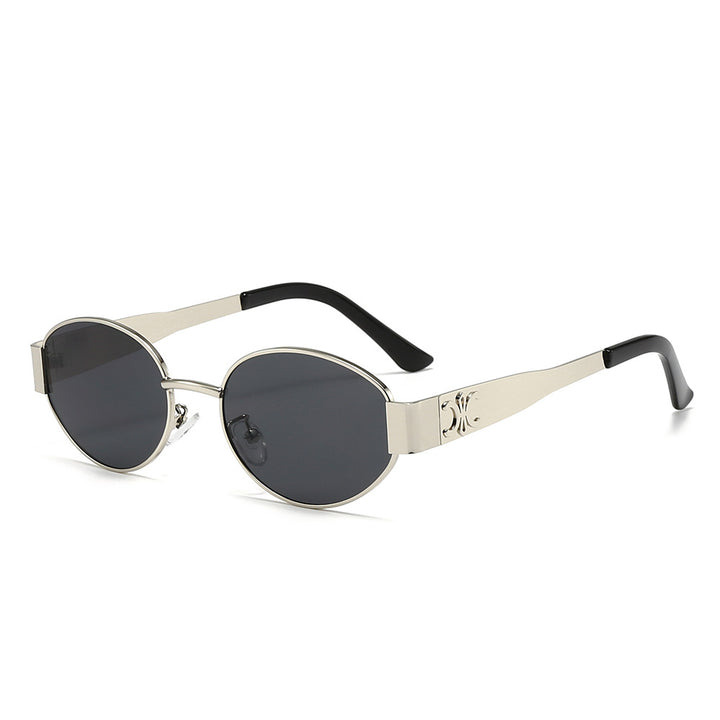 Dame Designer-solbrille med elegant oval ramme og unike aksenter Luvikno