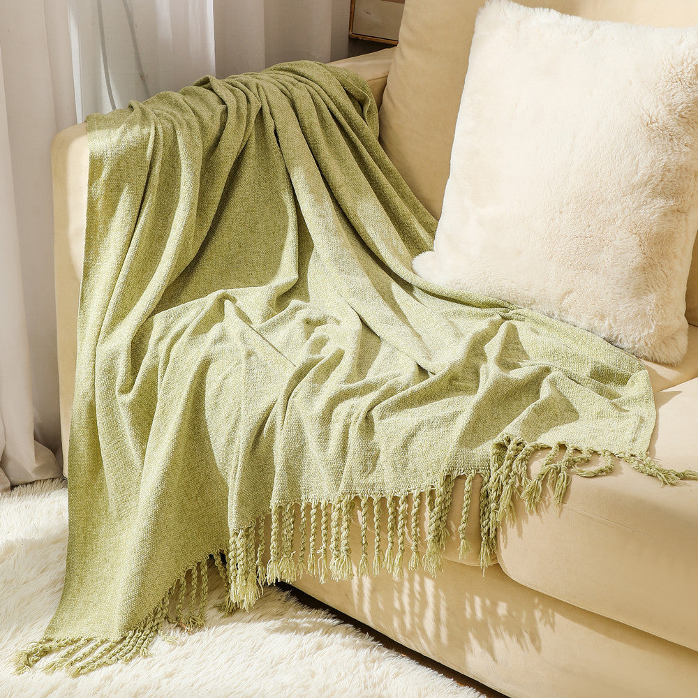 Kvinnelig elegant og stilfull sofa teppe med frynser Luvikno