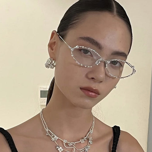 Dame eksklusiv solbrille med glitrende strass-dekor og elegant metallramme Luvikno