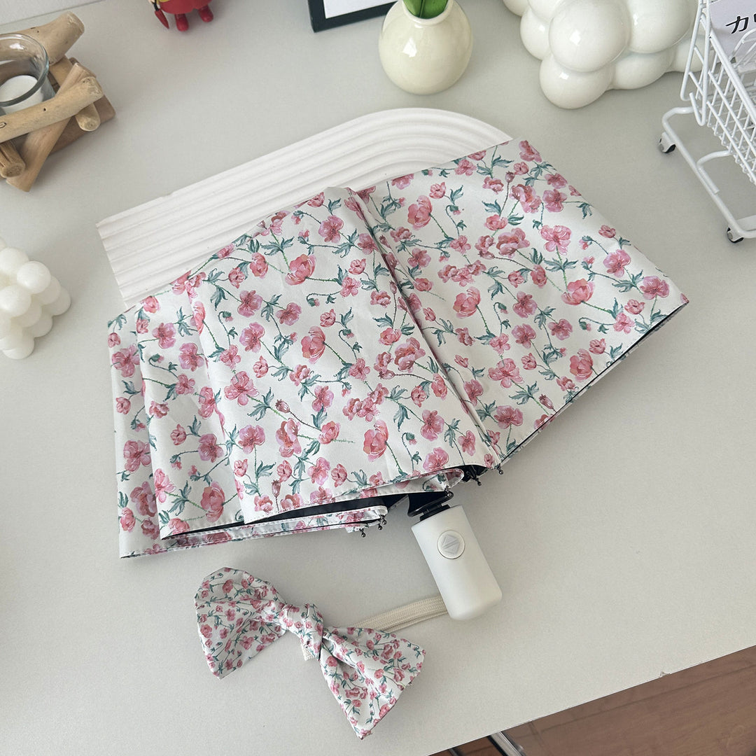 Dame sammenleggbare paraply med blomsterdesign og praktisk oppbevaringssystem Luvikno