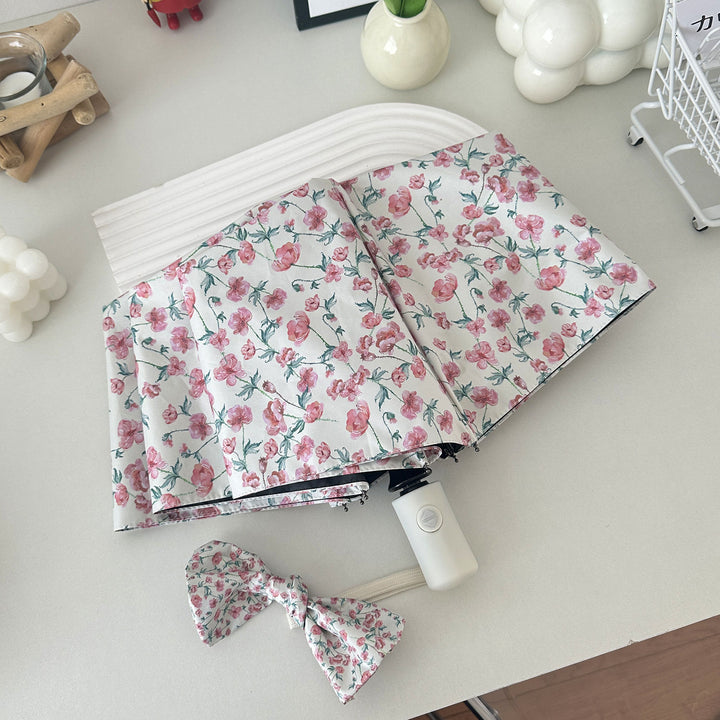 Dame sammenleggbare paraply med blomsterdesign og praktisk oppbevaringssystem Luvikno