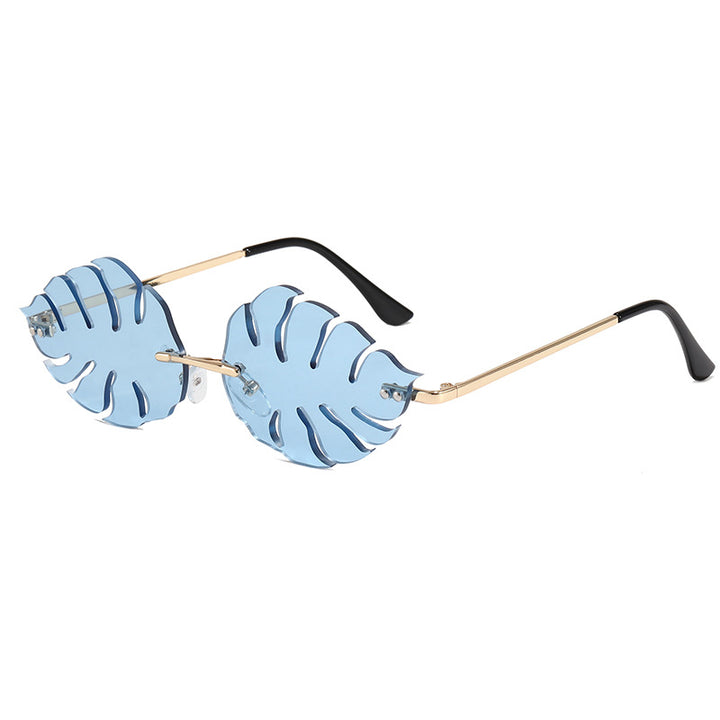 Dama moteriktig solbrille med markant bladerdesign Luvikno