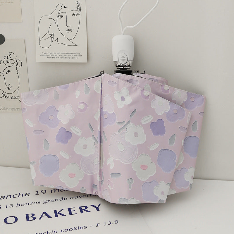 Dame sammenleggbar paraply med stilfullt blomstedesign Luvikno
