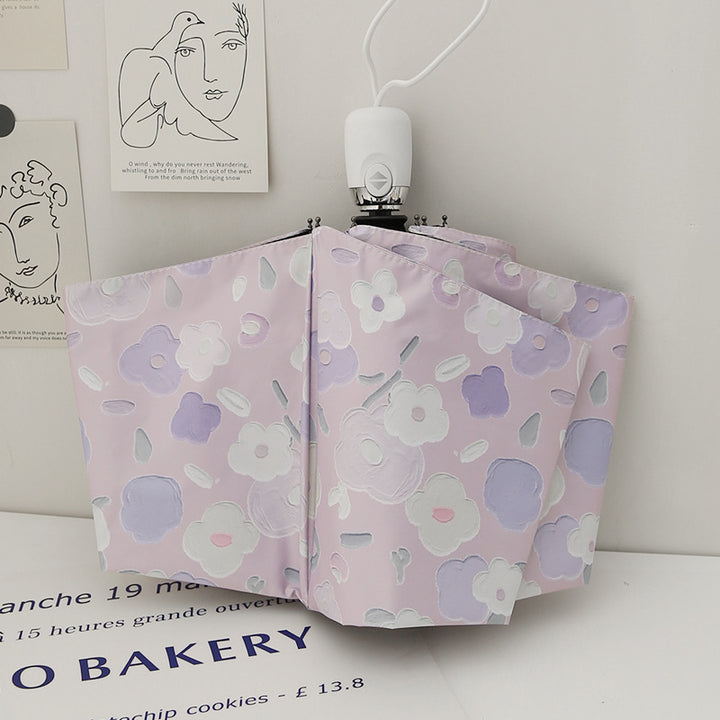 Dame sammenleggbar paraply med stilfullt blomstedesign Luvikno