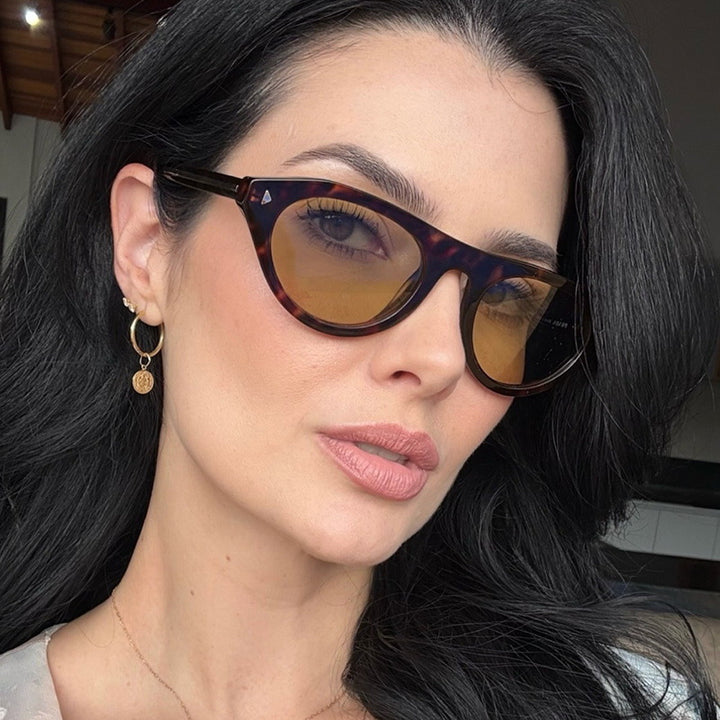 Dames moteriktig solbrille med buet ramme og beskyttende UV-filter Luvikno