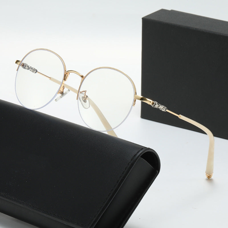 Dame rund solbrille med elegant metallramme og komfortable nesepads Luvikno