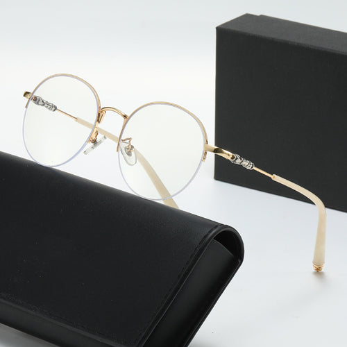 Dame rund solbrille med elegant metallramme og komfortable nesepads Luvikno