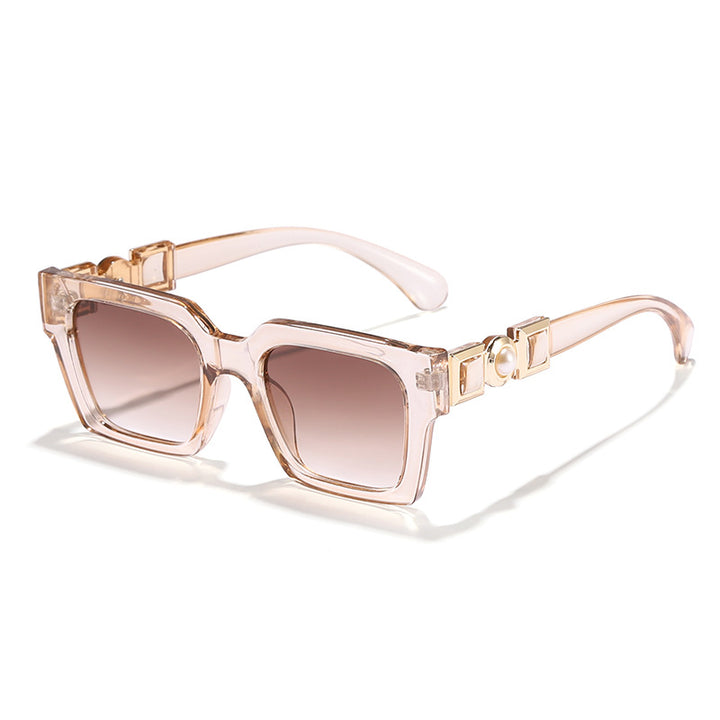 Dame moteriktig solbrille med glamorøst ramme Luvikno