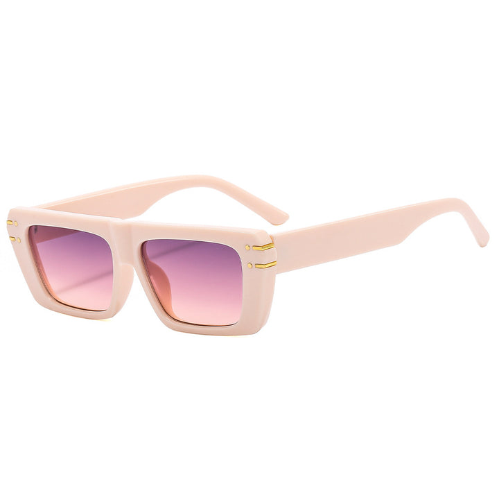 Dame moteriktig kvadratisk solbrille med glitrende akenter Luvikno