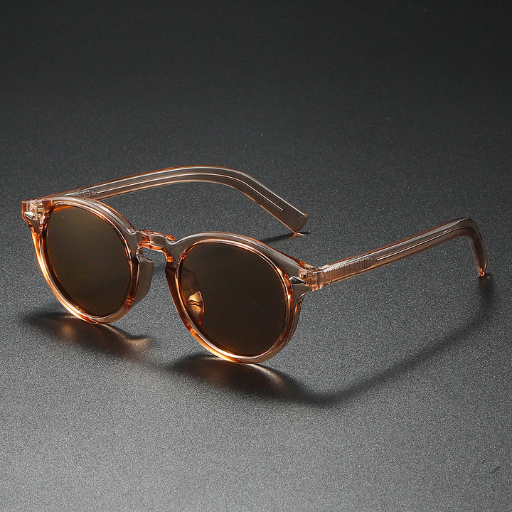 Dame Rund-solbrille med transparent ramme og reflekterende glass Luvikno