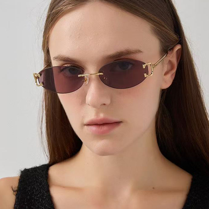 Dame elegant ovalformet solbrille med moderne metalramme Luvikno