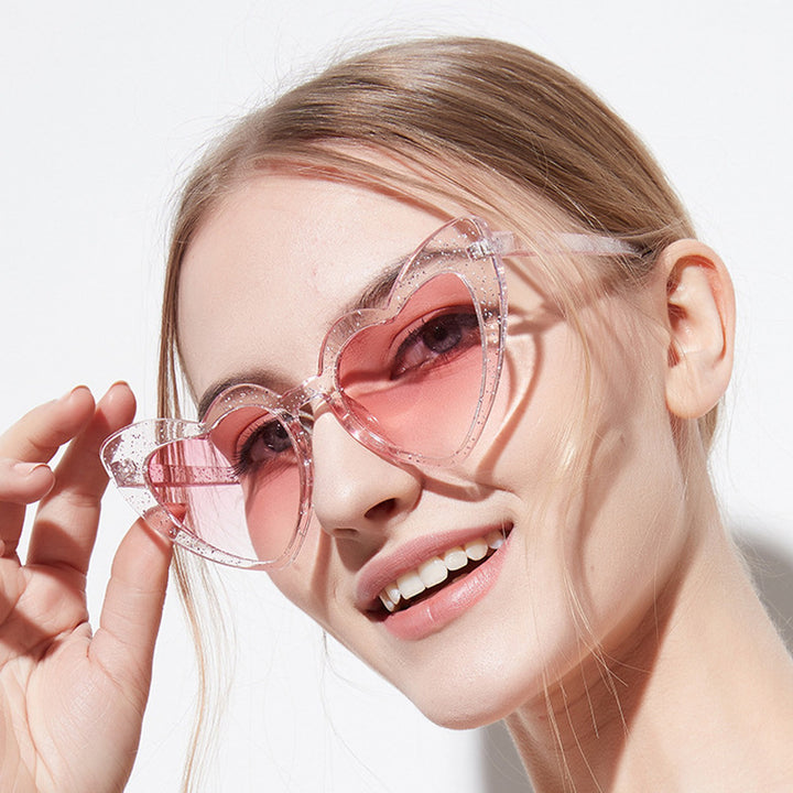 Dame hjerteformet solbrille med glitrende ramme Luvikno