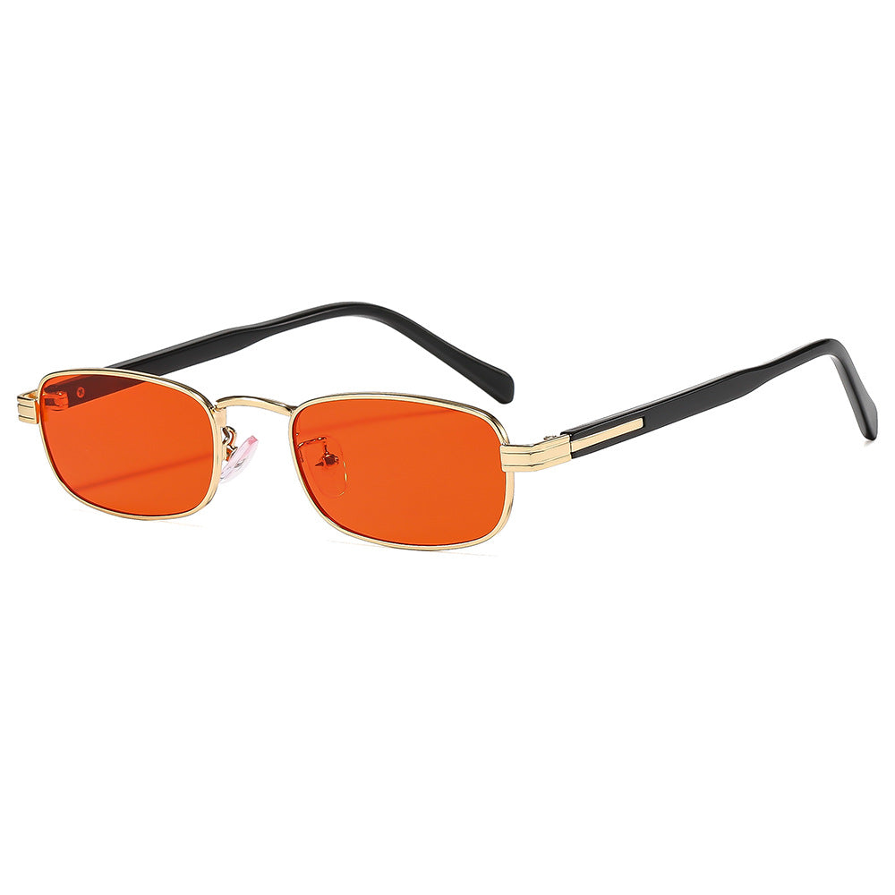 Dame moteriktige solbriller med stilfull metallramme og oransje linser Luvikno
