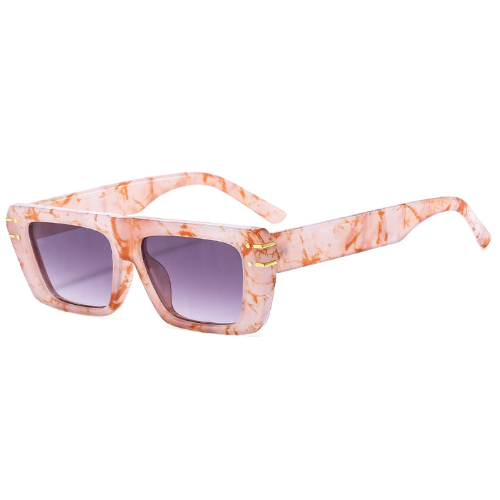 Dame moteriktig kvadratisk solbrille med glitrende akenter Luvikno
