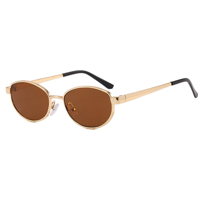 Dame moteriktig solbrille i elegant oval design med ramme i høykvalitets metall Luvikno