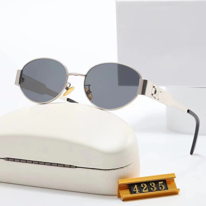 Dame elegant oval solbrille med gullfarget ramme Luvikno