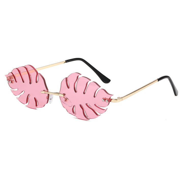 Dama moteriktig solbrille med markant bladerdesign Luvikno