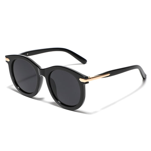 Dame moteriktig solbrille med gjennomsiktig ramme og gull accenter Luvikno