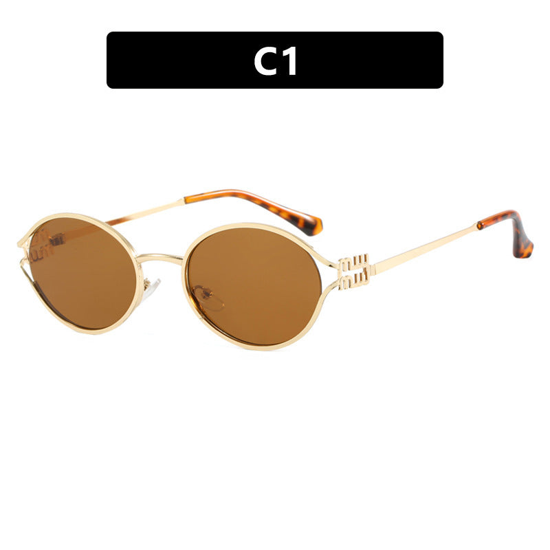 Dame ovalformet solbrille med elegant metallramme og moderne design Luvikno
