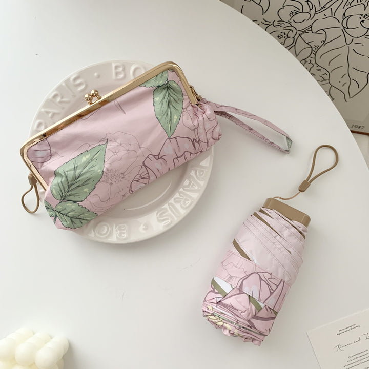 Damer elegant foldeparaply med blomsterdesign og praktisk etui Luvikno