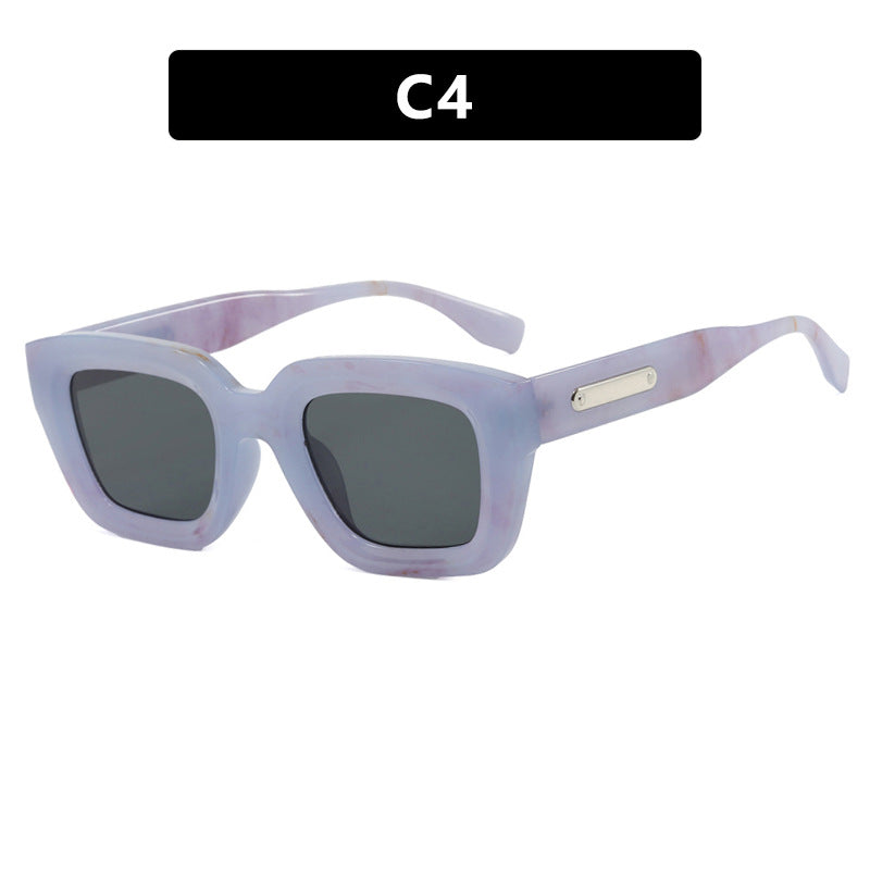 Dame kvadratisk solbrille med gjennomsiktig ramme og brune glass Luvikno