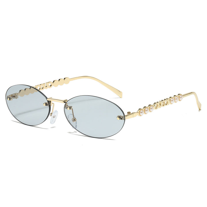 Dame moteriktig solbrille med oval ramme og perledekorert bøyle Luvikno