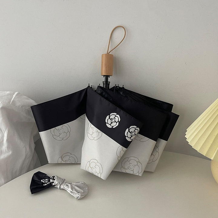 Dame elegant paraply med stilfullt blomsterdesign Luvikno
