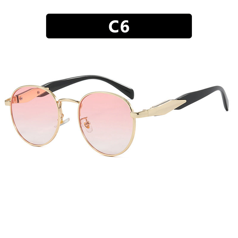 Dame rund solbrille med elegant, gullramme og UV-beskyttelse Luvikno