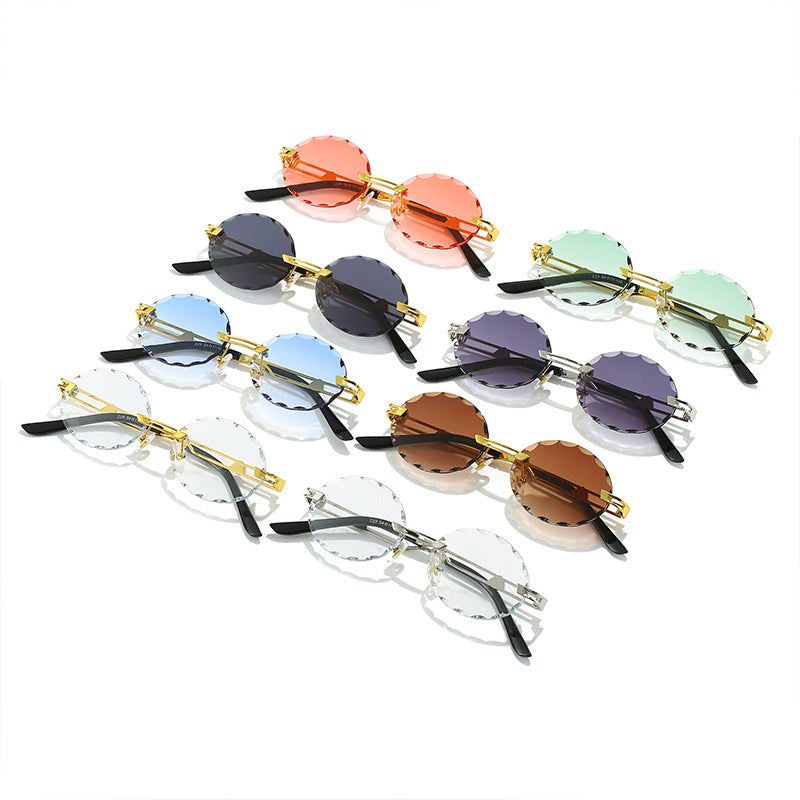Dame rund solbrille med unikt bølgedesign og høykvalitets metallramme Luvikno