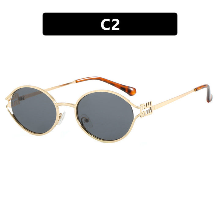 Dame ovalformet solbrille med elegant metallramme og moderne design Luvikno