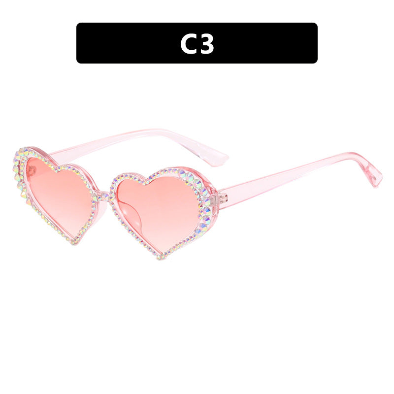 Dame hjerteformet solbrille med strassbesatt ramme Luvikno