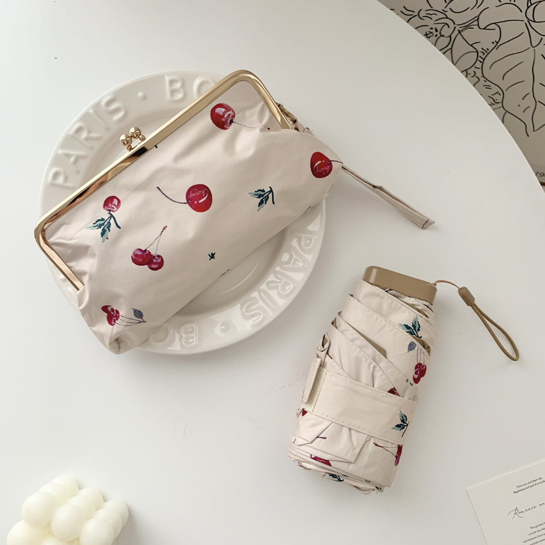 Damer elegant foldeparaply med blomsterdesign og praktisk etui Luvikno