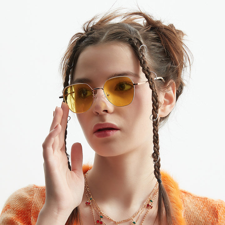 Dame moteriktig solbrille med smal metallramme og blå linser Luvikno