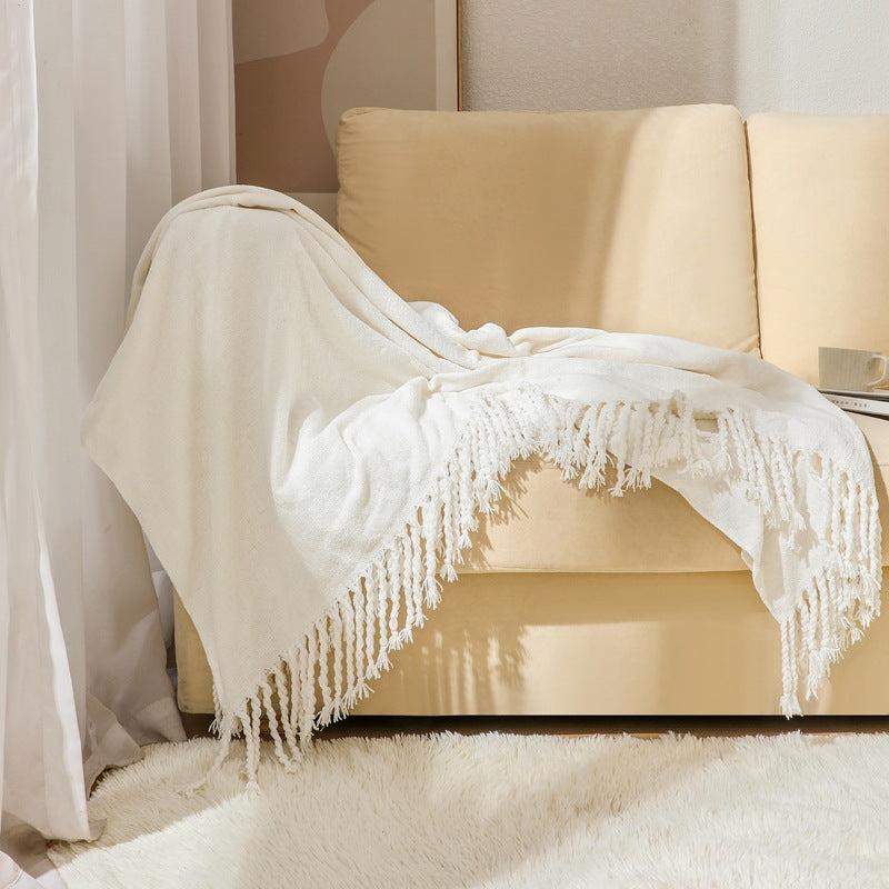 Kvinnelig elegant og stilfull sofa teppe med frynser Luvikno